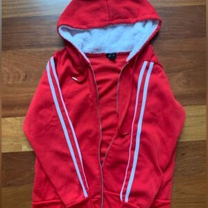 Justify red zip-up.
